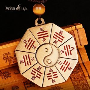 Double-sided Bagua pendant with Yin-Yang symbol and cinnabar detail