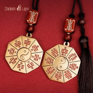 Double-sided Bagua pendant with Yin-Yang symbol and cinnabar detail