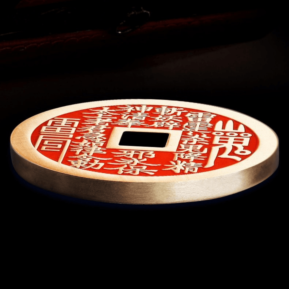 Feng Shui hanging ornament featuring cinnabar amulet coin and Bagua symbol