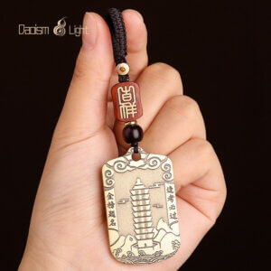 Traditional brass academic charm for students and exams