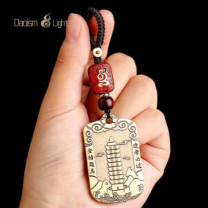 Traditional brass academic charm for students and exams