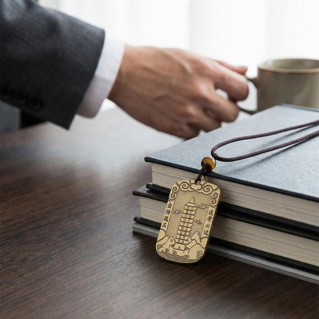 Brass study luck pendant with cloud and mountain motifs