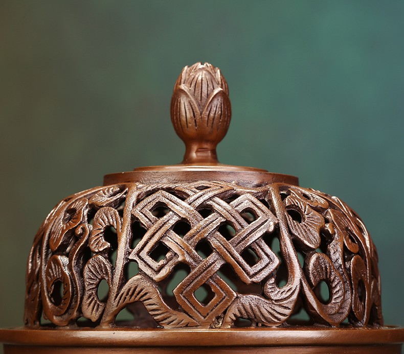 lotus incense burner with smoke in zen tea room