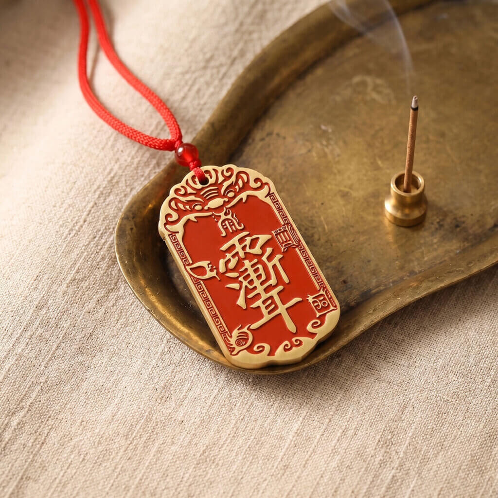 Daoist-inspired brass pendant charm with traditional symbolic design