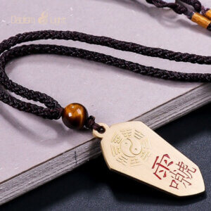 Brown cord brass pendant with Daoist talisman design