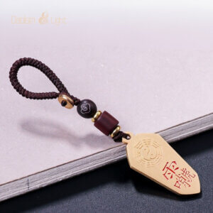Brass pendant with Vajra knot cord and Daoist symbol design