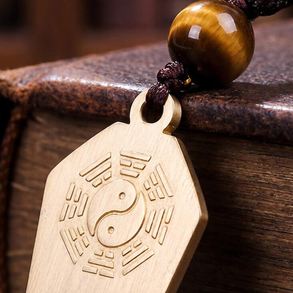 Front detail of brass pendant with Bagua and Taiji center