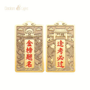 Back side of brass ornament showing the Dragon Gate architectural portal, twin koi, and Feng Kao Bi Guo inscription