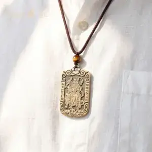 Zhao Gongming tiger brass pendant necklace styled with casual clothing